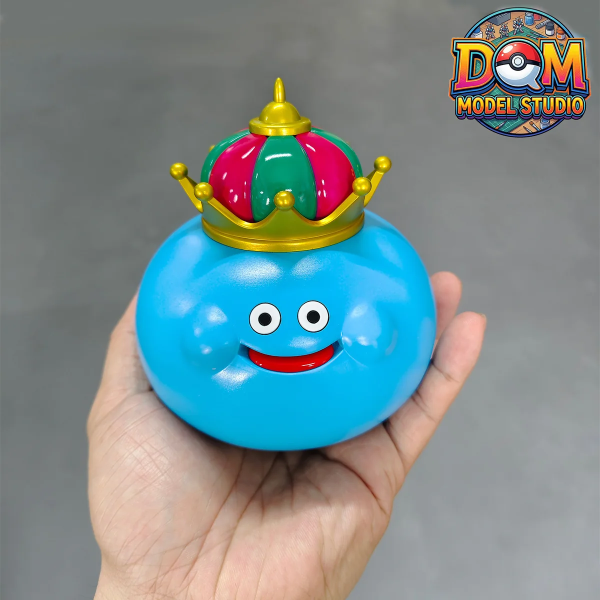 "Close-up of the playful Dragon Quest Slime family resin statue, revealing intricate sculpture details and vibrant colors from various angles."