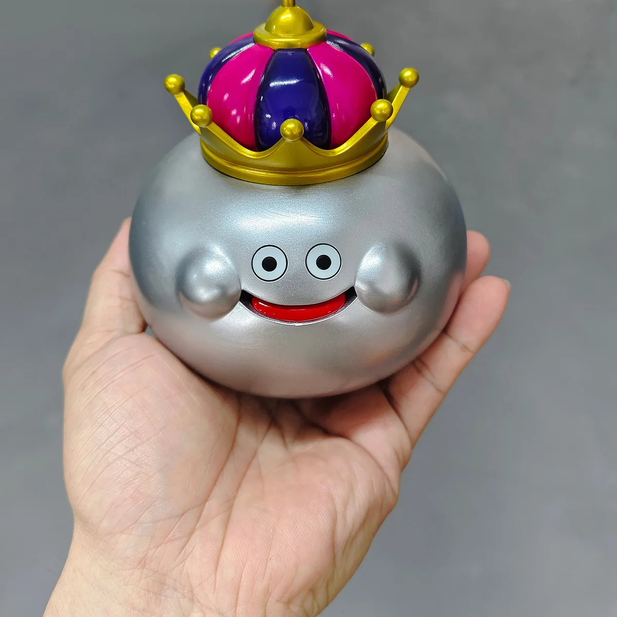 "A playful gallery showcasing the vibrant Dragon Quest Slime family resin figures from various angles, highlighting their iconic forms."