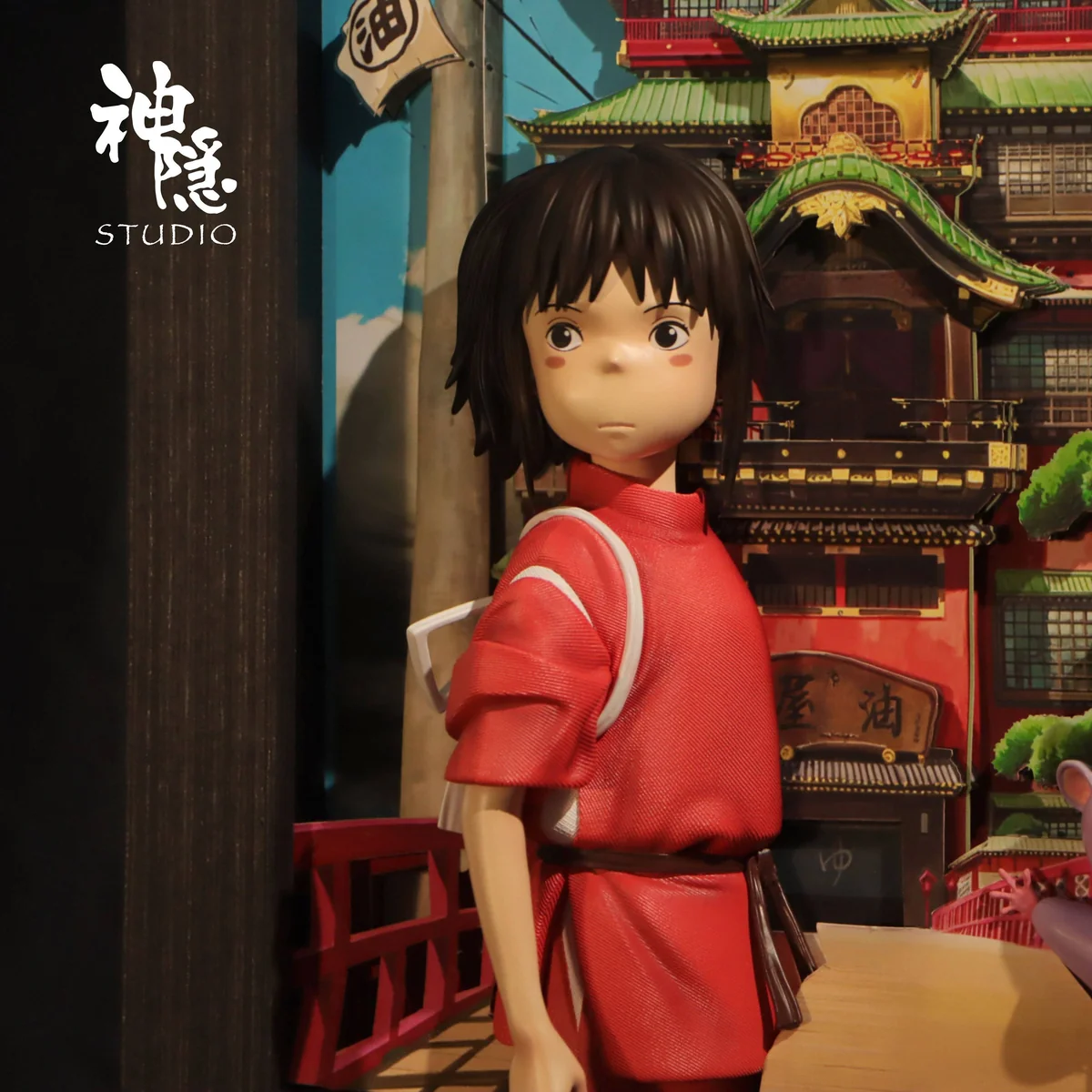 "Detailed view of the Spirited Away Chihiro & Bo Companionship Wall Art resin diorama. Showcases intricate sculpture and premium finish from a unique