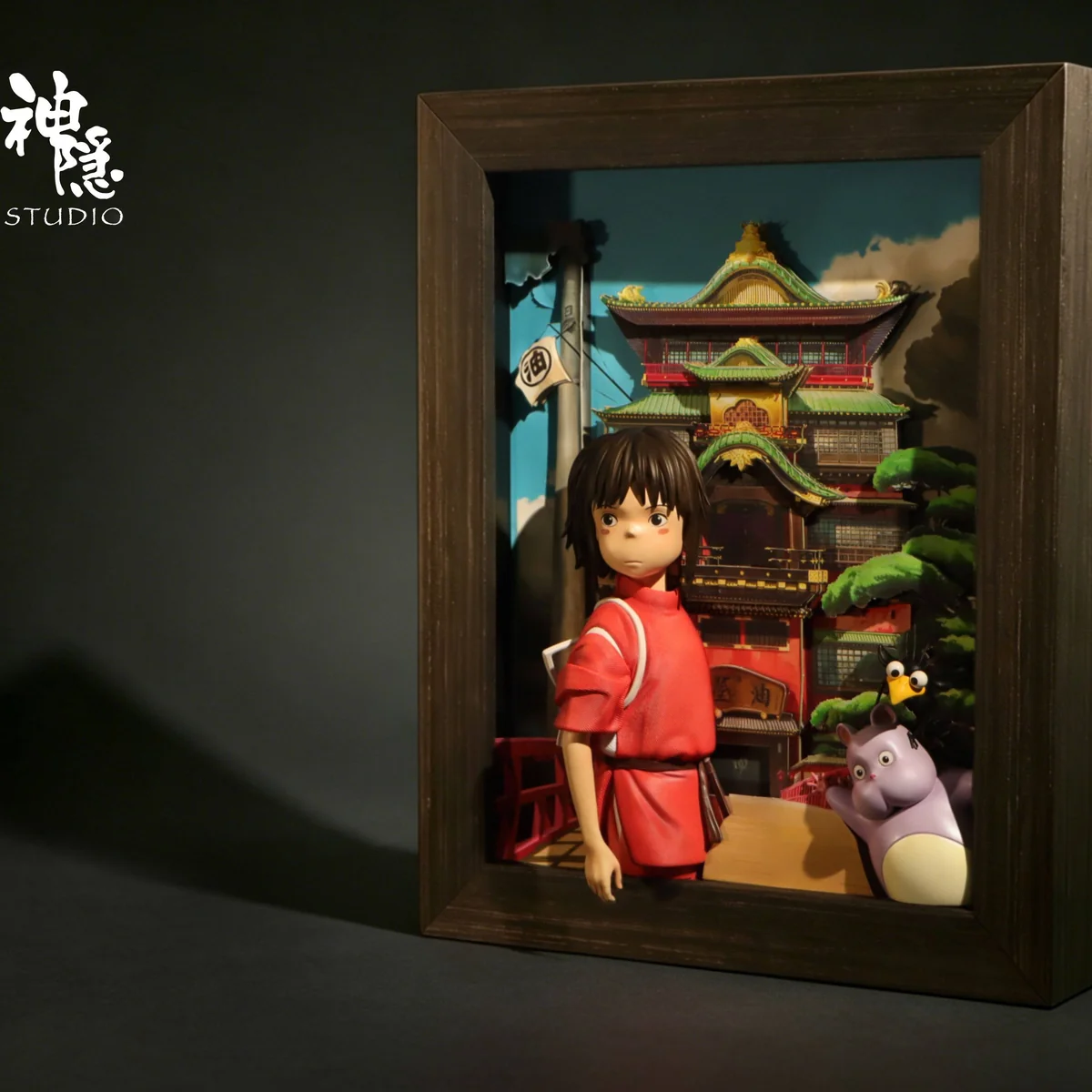 "Explore detailed angles and premium sculpt work of the Chihiro & Bo Companionship Wall Art resin statue, an iconic Spirited Away bathhouse diorama."