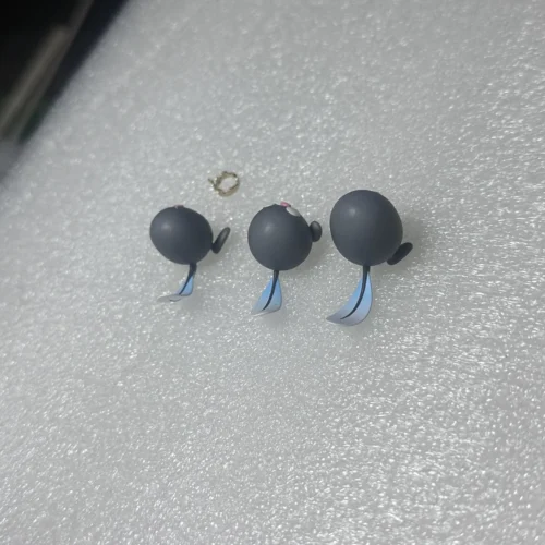 "Manga-accurate Pokemon Special Poliwag figure set. Multiple angles reveal the monochromatic, artistic statue's intricate details and iconic moments."