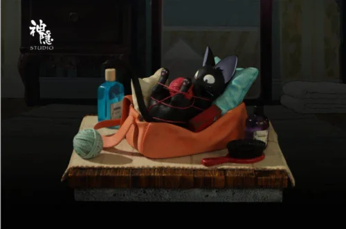 "Authentic Jiji's Playtime Kiki's Delivery Service resin statue. This whimsical Kiki's Jiji figure peeks playfully from a cozy, textured bag diorama."