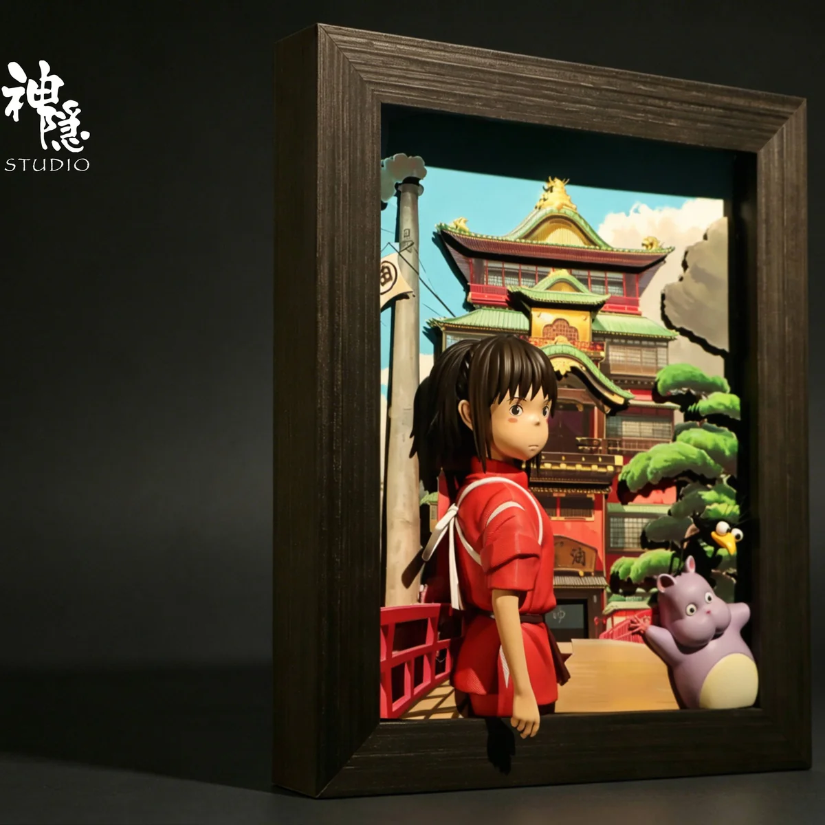 "Spirited Away Chihiro & Bo wall art resin statue with intricate sculptural details from various angles of the iconic Ghibli bathhouse."