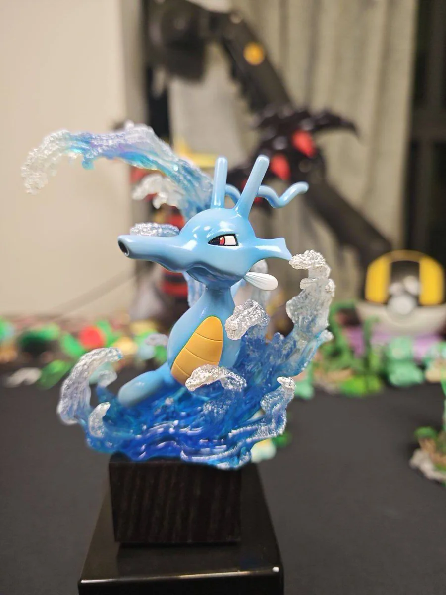 "Dynamic aquatic display of the complete Horsea, Seadra, and Kingdra Pokemon evolution set statue, showcasing intricate details from multiple premium
