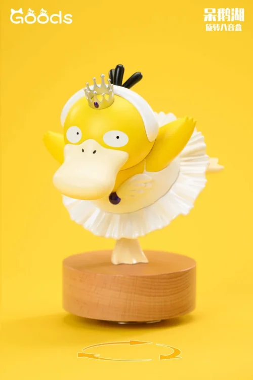 "Whimsical Psyduck ballerina twirling on a rotating 'Stay Goose Lake' music box, a playful Pokémon statue that brings the Swan Lake parody to life."