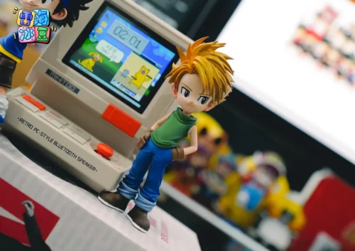 "Playful chibi Digimon Yamato WCF figure by Lei Hai Bing Dou Studio. Dynamic pose, vibrant colors, and iconic attire detailed from multiple angles."