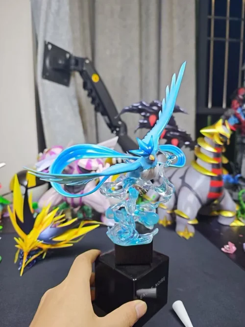 "Dynamic Zapdos and Articuno legendary Pokémon statue by Forge Craftsman Studio, showcasing intricate elemental cloud bases and powerful poses."