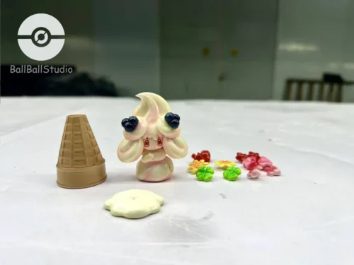 "Adorable Alcremie Pokémon figure statue, showcasing its vibrant dessert theme and highly customizable features with interchangeable sweet accessories."