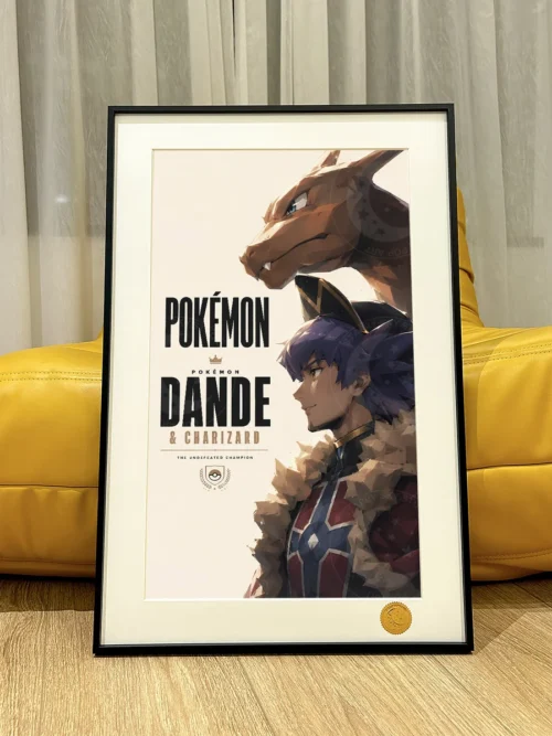 "Limited edition framed collector-grade Pokémon art print showcasing Trainer Leon, Charizard, Ash, and Pikachu in a dynamic starry sky battle."