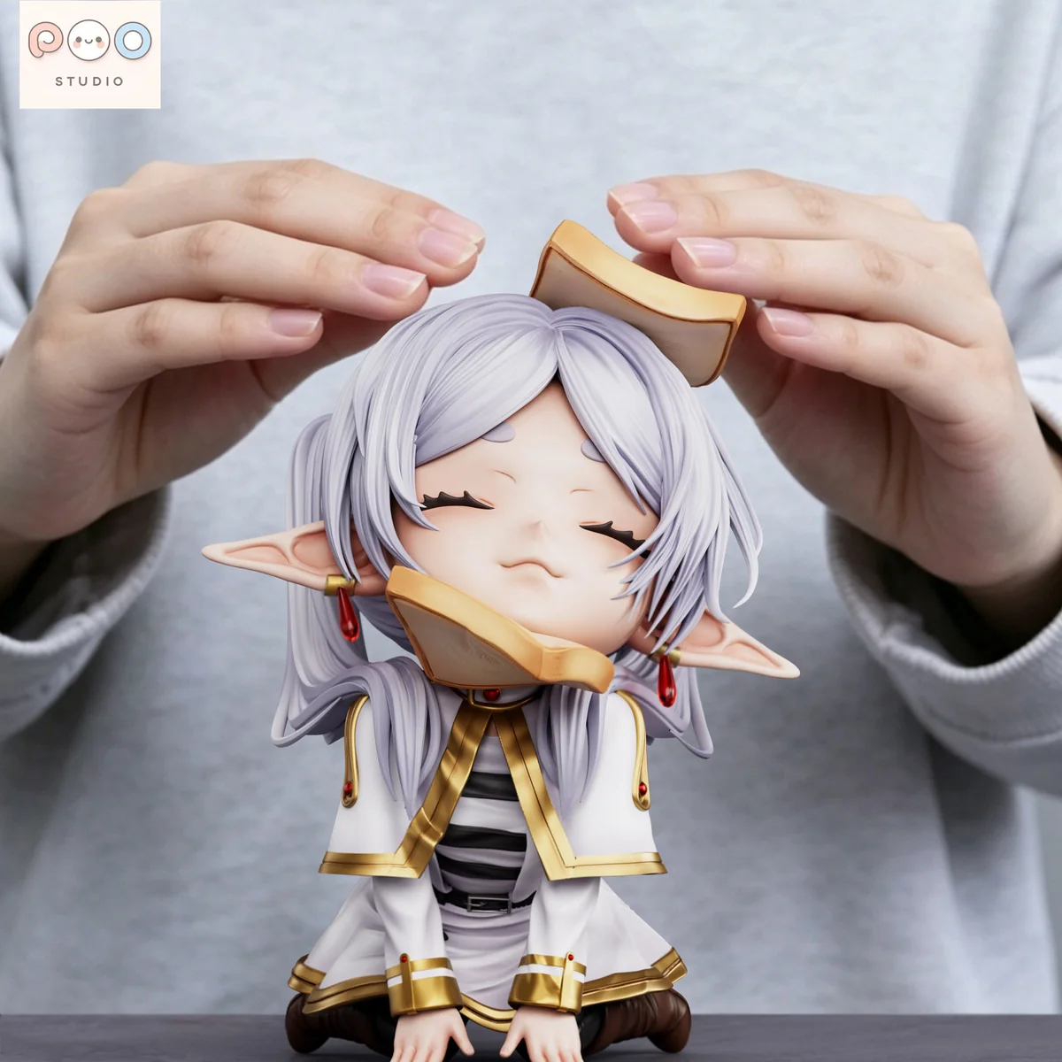 "Detailed shot of the whimsical Bread Bun Frieren figure by popo Studio, highlighting the premium quality sculpting and charming elements of its unique."