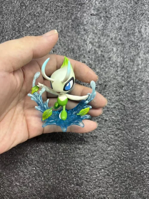"Exquisite 1/20 & 1/10 Celebi Pokemon figure by Smile Studio. Celebi gracefully flies in a whimsical forest with vibrant flora and a dynamic natural."