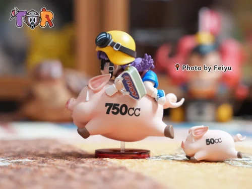 "Iconic Arale WCF figure riding a cheerful pig, detailed views from multiple angles highlight the whimsical Dr. Slump charm and expert sculpting."