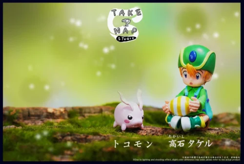 "Limited Edition Digimon Adventure Takeru & Hikari chibi naptime figures, showing adorable sculpted details and peaceful poses from a playful angle."