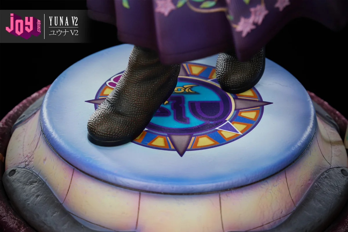 "Premium 1/3 scale Final Fantasy X Yuna 2.0 resin statue, capturing her dynamic summoner pose amidst ethereal water and spiritual effects."