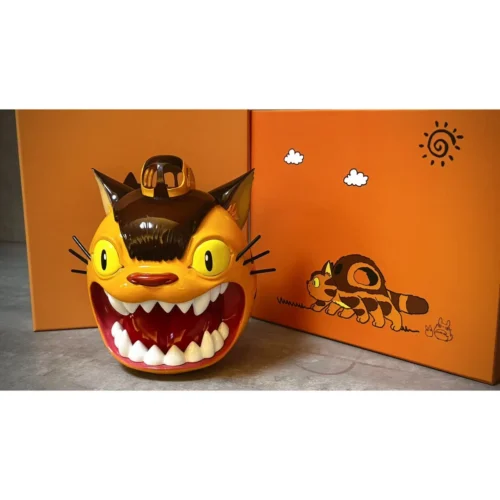 "Whimsical Totoro Catbus Daruma collectible figure, showing the unique Catbus carrying Totoro and intricate sculpture details from various angles."