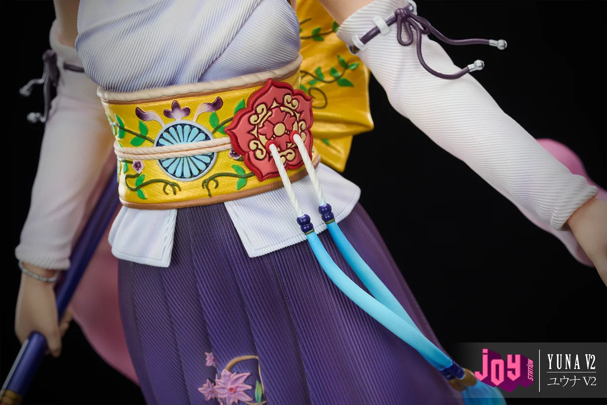 "Premium 1/3 scale Final Fantasy X Yuna 2.0 resin statue, capturing her dynamic summoner pose amidst ethereal water and spiritual effects."