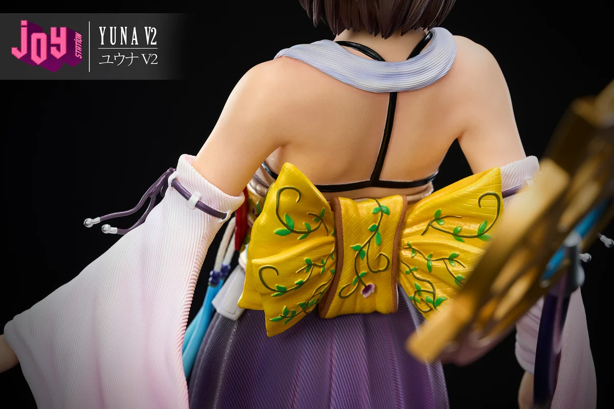 "Premium 1/3 scale Final Fantasy X Yuna 2.0 resin statue, capturing her dynamic summoner pose amidst ethereal water and spiritual effects."