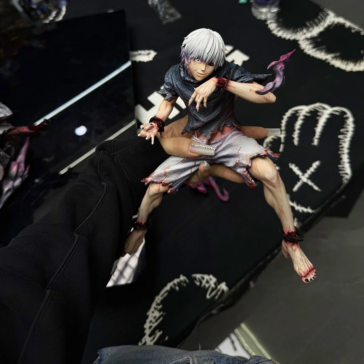 "A dynamic, aggressive 1/6 scale Kaneki Ken Tokyo Ghoul statue by Wanxiang Studio, showcasing intricate details of his powerful Kagune from various."
