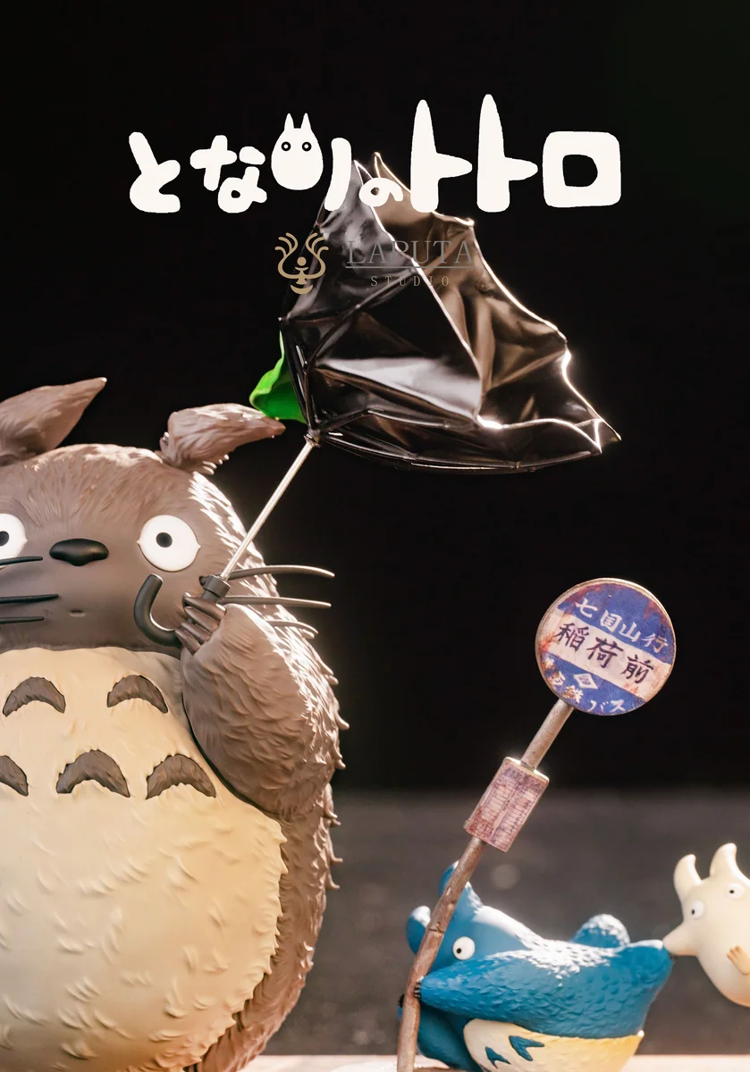 "Artistic Totoro: Wind Advisory resin statue by LAPUTA-studio, showcasing whimsical wind-swept characters on its elegant premium wood base."