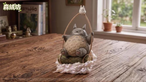 "Iconic Totoro figure playfully swinging on a cloud, a premium resin statue from My Neighbor Totoro, full of whimsical charm."