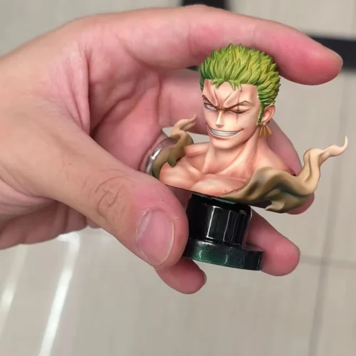"Limited Edition Roronoa Zoro Statue with metal swords and interchangeable bust, showcasing its dynamic pose and intricate sculpt details."