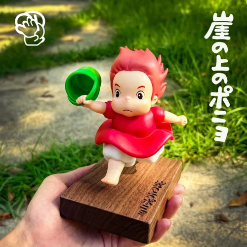 "Iconic Studio Ghibli Ponyo running figure: a vibrant, limited edition resin statue capturing her dynamic, joyful energy on ocean waves."