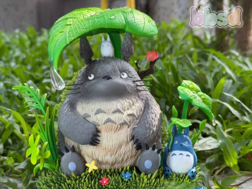 "Collectible My Neighbor Totoro Hiding from the Rain resin statue, a limited edition diorama depicting Totoro in a charming, whimsical Ghibli forest."