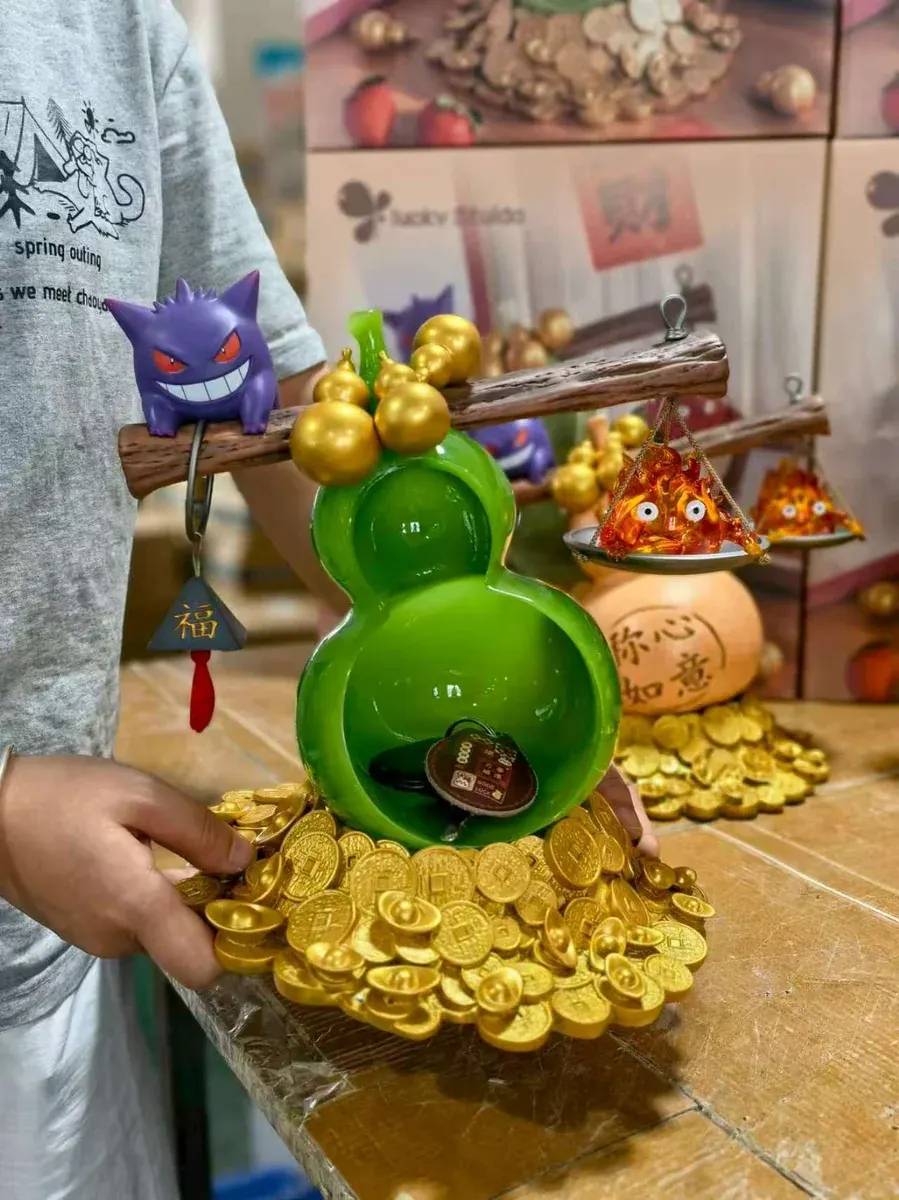 "Detailed images of the Gengar & Calcifer LED resin statue, with whimsical ghostly fire, intricate artistry, and mystical fortune-attracting appeal."