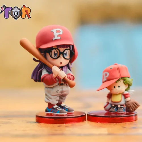 "Iconic Dr. Slump Arale & Gatchan WCF resin statue by TOR-Studios, captured in a vibrant, dynamic baseball scene with playful poses."