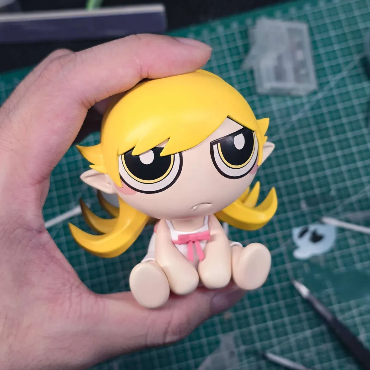 "Premium 1/6 Shinobu Oshino Monogatari figure. Dynamic pose, intricate sculpt, iconic donut, bonus detailed from all angles."