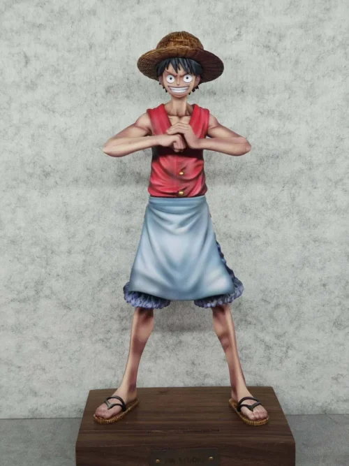 "Premium limited edition One Piece Luffy figure by AW Studio, showcasing unique Chef Luffy in a detailed culinary apron on a walnut base."