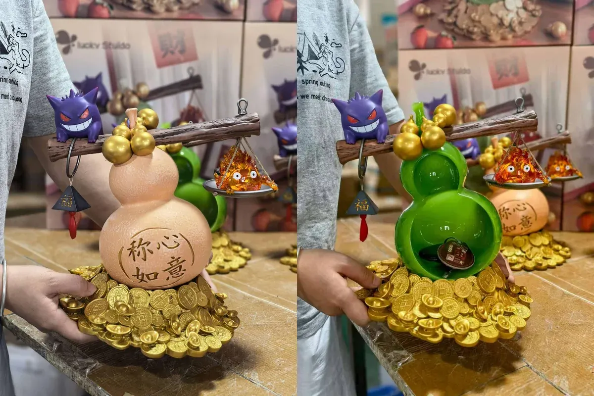 "Artistic Gengar & Calcifer LED resin statue, glowing mystically to attract fortune, a unique Pokémon Howl's Moving Castle display."
