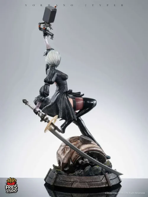 "Dynamic 1/3 scale NieR Automata 2B statue by Fries-Studios, showcasing intricate sculpting, multiple interchangeable heads, and premium details."