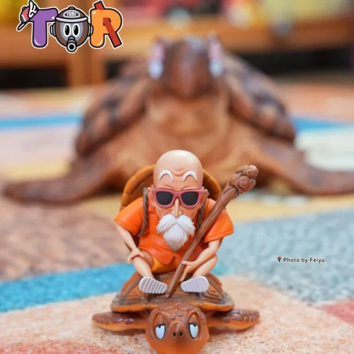 "WCF Kid Goku Figure by TOR-Studios. Goku rides Master Roshi's Turtle. Detailed views highlight this iconic Dragon Ball collectible's intricate sculpt."