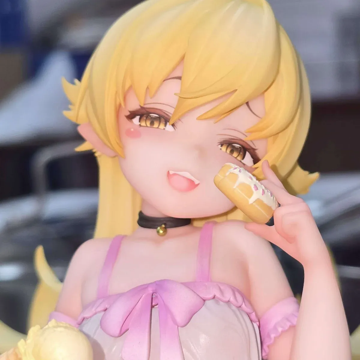 "Premium 1/6 scale Shinobu Oshino resin statue with bonus. Dynamic pose and intricate Monogatari details showcased from various angles."