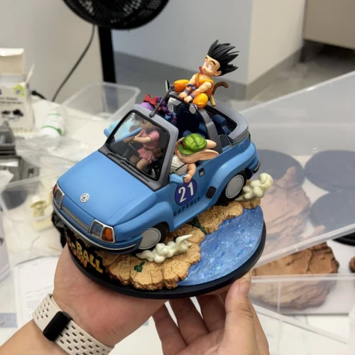 "Limited Edition Dragon Ball diorama figure showcasing Goku, Bulma, and Master Roshi playfully riding in their iconic blue buggy statue."
