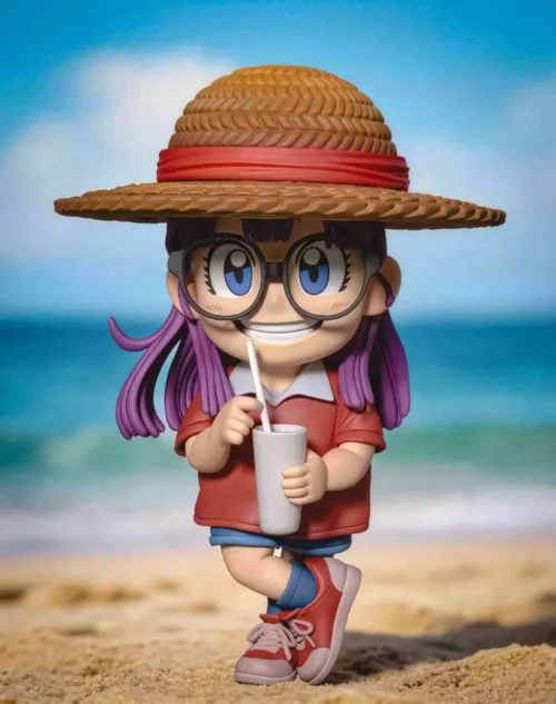 "Cheerful Arale WCF figure from Dr. Slump, wearing a unique straw hat. This vibrant and charming collectible showcases Arale's playful spirit."