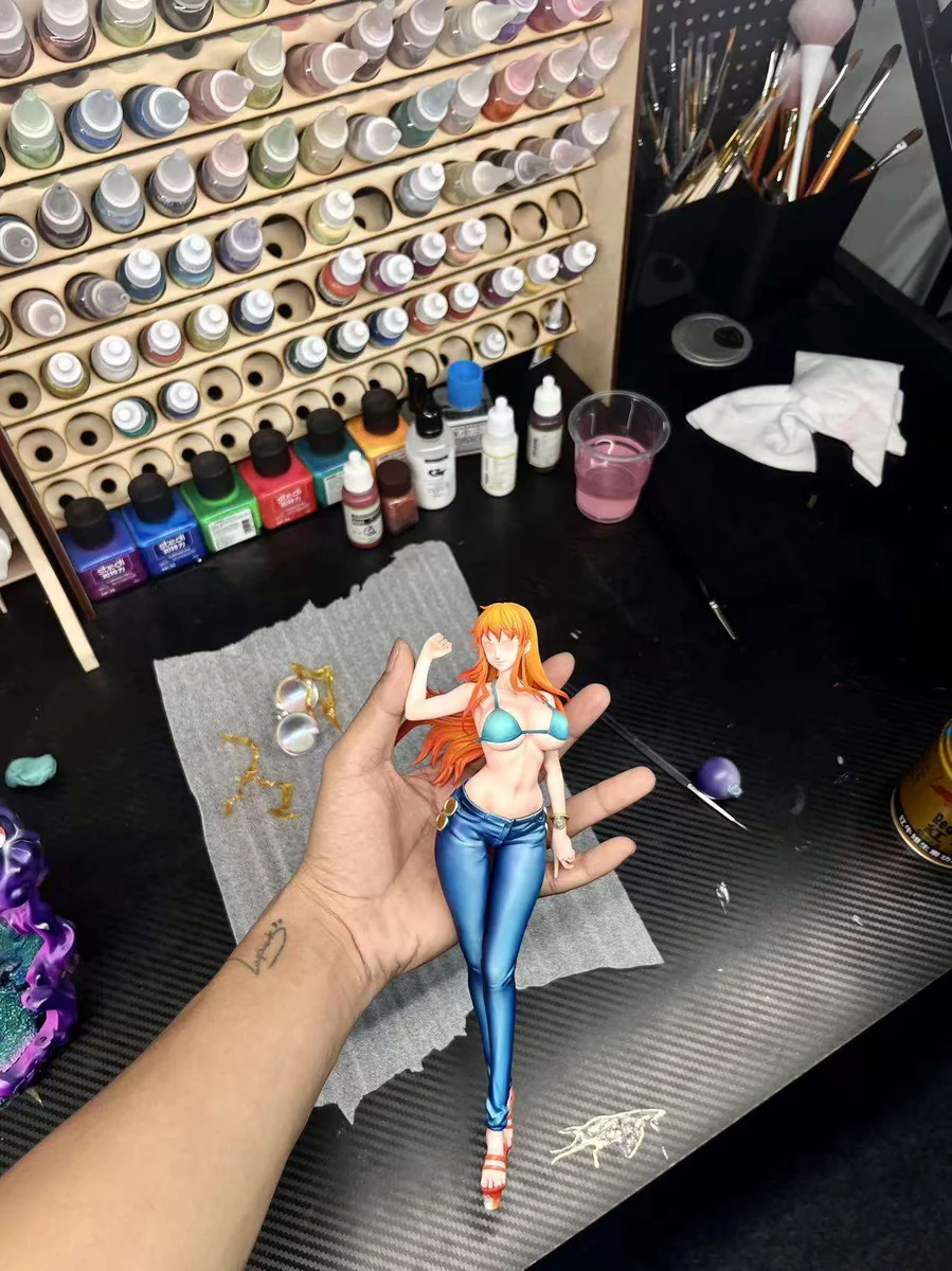 "Limited Edition 1/7 Nami (Post-Timeskip) One Piece figure in dynamic pose. Vibrant 2.5D paint style and intricate sculpted details from all angles."