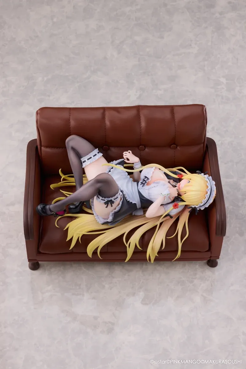 "Exquisite Ariko Bishoujo Mangakyo statue from Pinkmango Studio. Elegant pose on a sofa, highlighting alluring design and intricate sculpt details."