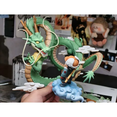 "Exclusive Goku's Dragon Wish Dragon Ball Statue: sculptural views of Kid Goku and Shenron in whimsical winter diorama."