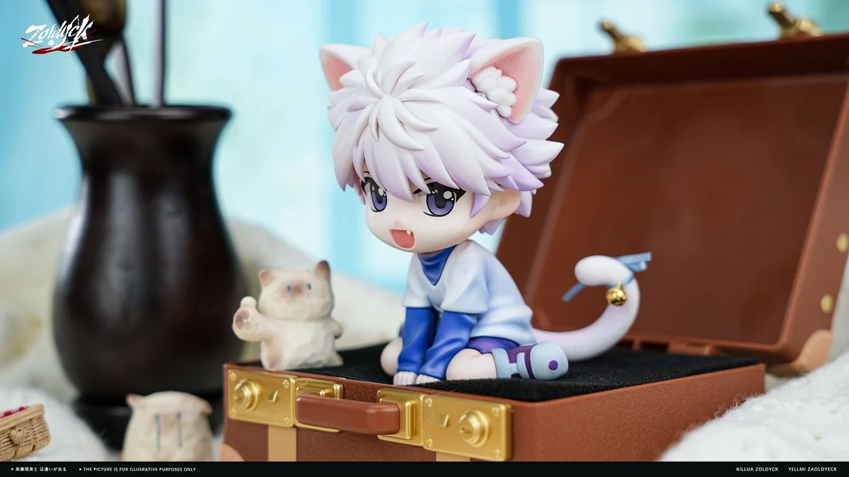 Playful chibi Killua cat figure with flocked ears and tail, seated on an open suitcase with a removable working bell and detailed resin sculpt."