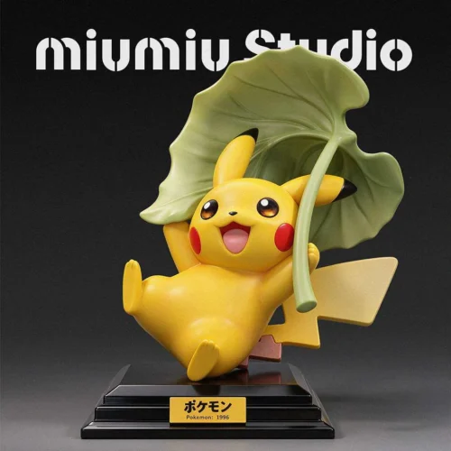 Cheerful limited-edition 99-piece 1/10 Pikachu gliding figure soars under an oversized green leaf on a glossy black base by Miumiu Studio.