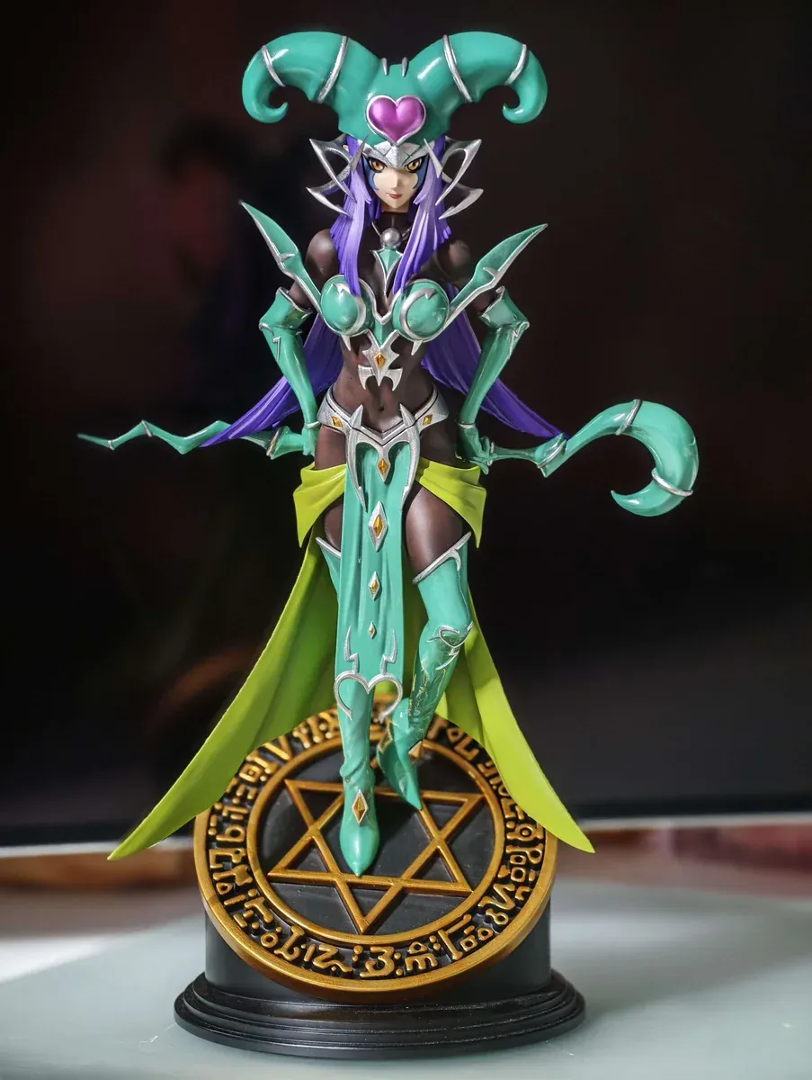 Kiwi-green Dark Magician Girl figure statue with pink heart crown on golden pentagram base, limited 100-piece premium resin collectible.