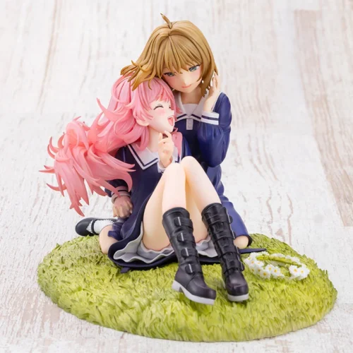 Kotobukiya Shina Mimi figure statue shows two schoolgirls in navy uniforms embracing tenderly on a grassy base with a daisy flower crown.