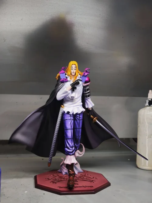 "Dynamic Basil Hawkins One Piece statue by Longhu Studio, showcasing his powerful character rendition and intricate card details in a dramatic pose."