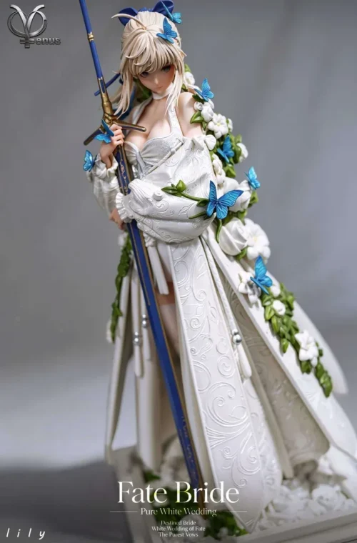 "Exquisite 1/4 Artoria Lily Wedding Gown Fate statue. Artoria poses elegantly in a pure white gown with intricate floral base and ethereal blue."