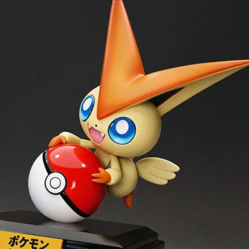 Cheerful 1/10 scale Victini resin figure with crisp sculpted details hugging an oversized Poké Ball on a glossy black base, limited to 99 pieces.