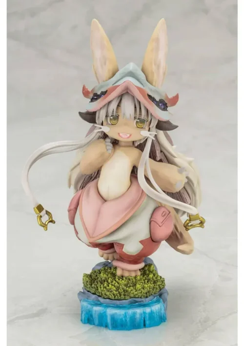 Kotobukiya Nanachi figure from Made in Abyss, an official statue on a mossy waterfall diorama base with soft pastel fur and layered hat.