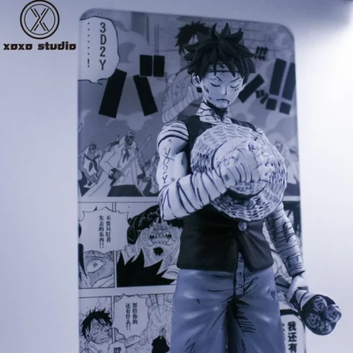 "See various angles of the Limited Edition Mourning Luffy One Piece resin statue, emphasizing its striking black & white manga style and poignant."