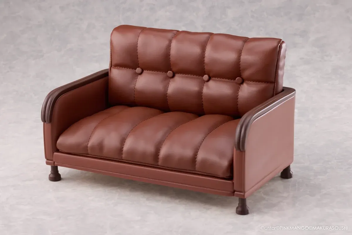 "Exquisite Ariko Bishoujo Mangakyo statue from Pinkmango Studio. Elegant pose on a sofa, highlighting alluring design and intricate sculpt details."